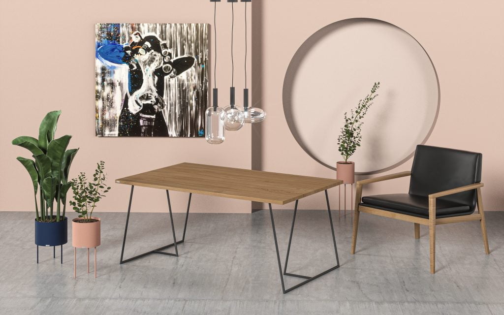 Duży stół wykonany z drewna i metalu w salonie z jasnymi ścianami